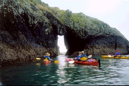 Paddling through archway near Moturoa Is